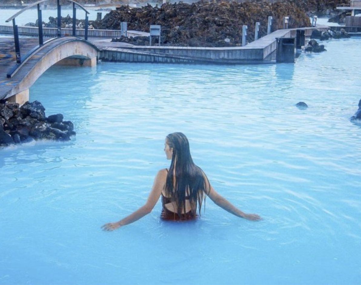 Relaxing geothermal Blue Lagoon spa in Iceland with milky-blue water and surrounding lava fields.