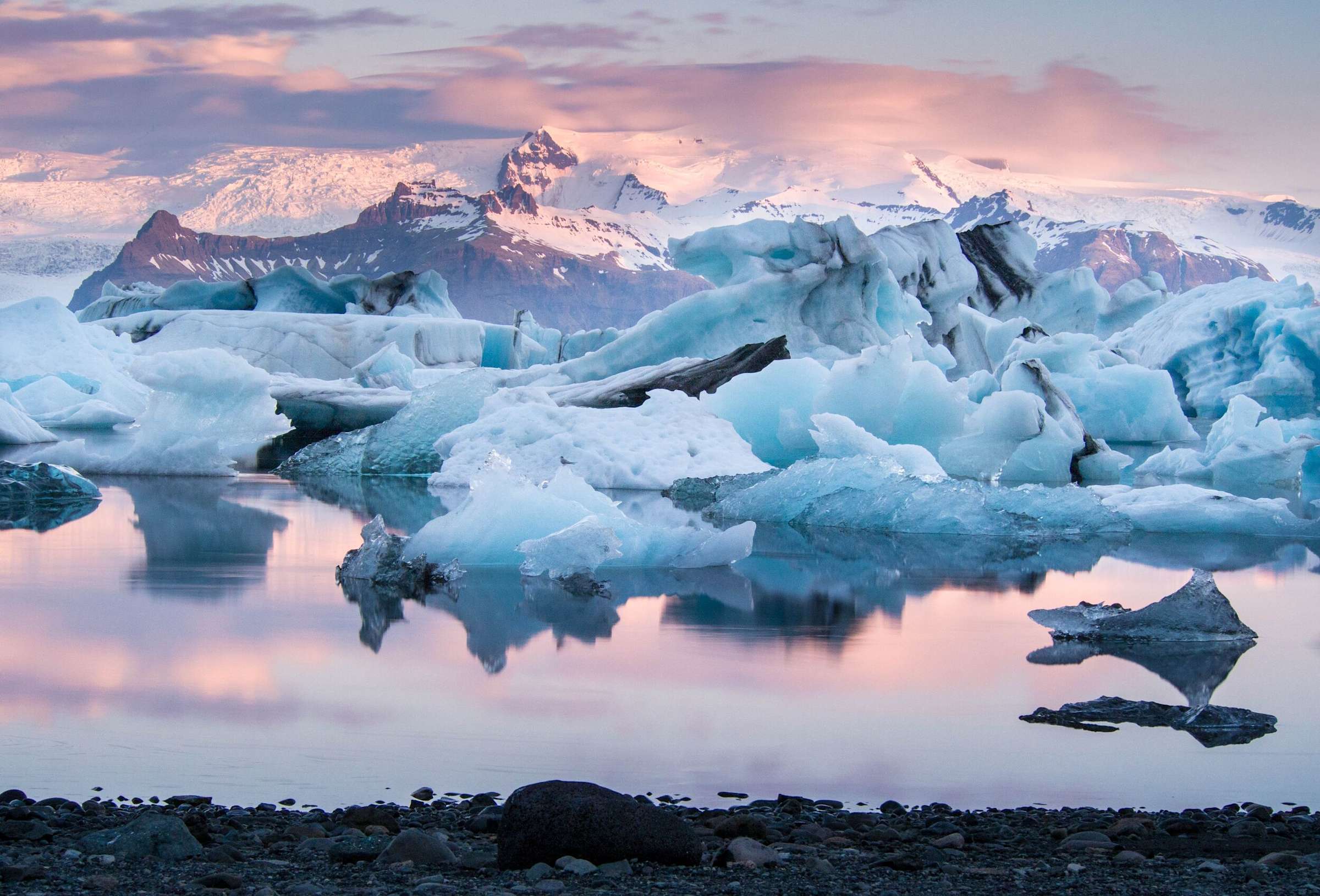 Diamond Beach in Iceland with glittering ice fragments scattered across the black-sand shoreline.
