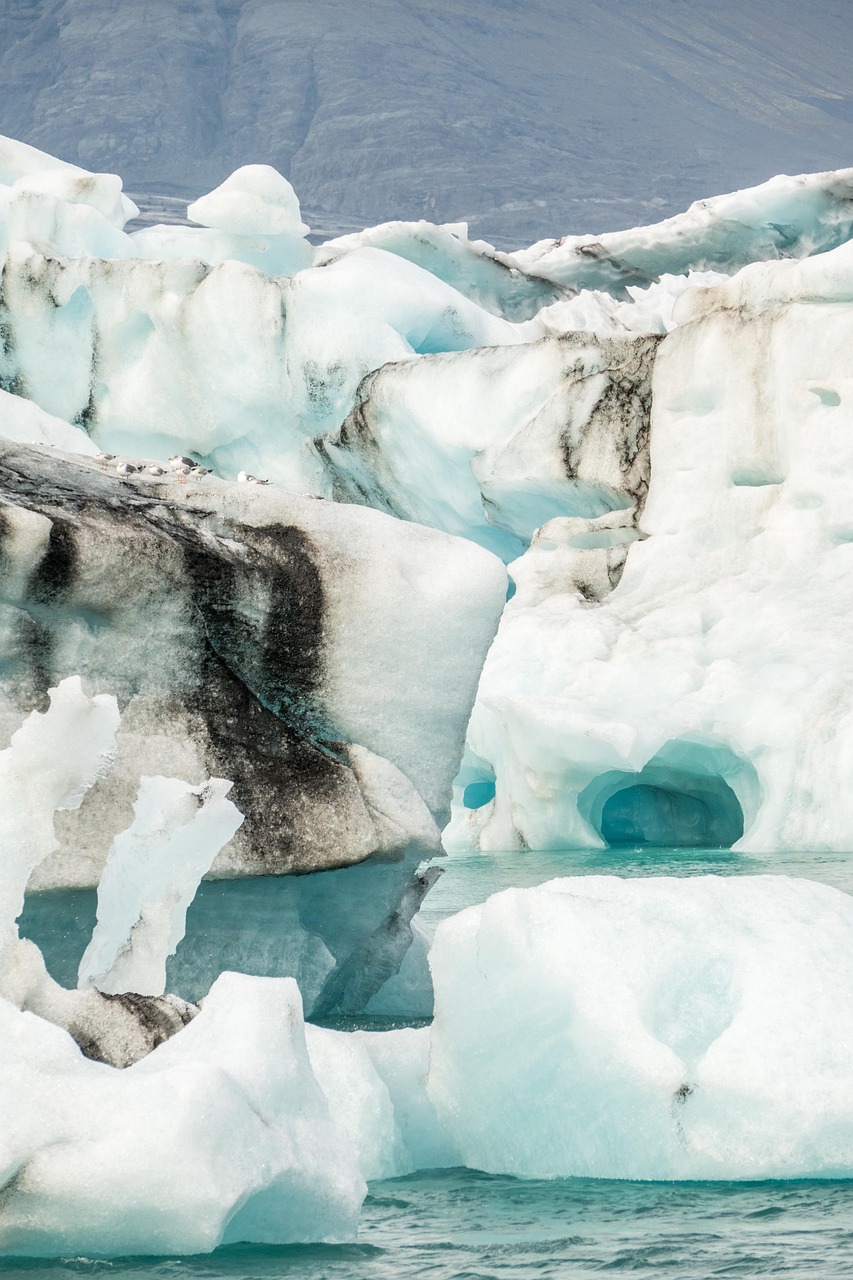Blue ice formations and melting glaciers at Jökulsárlón Glacier Lagoon in Iceland.
